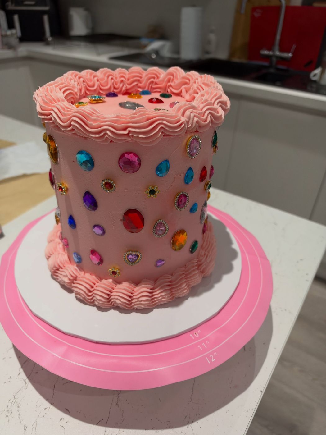A pink vintage-style heart cake topped with cherries by Lisa's Heavenly Bakes
